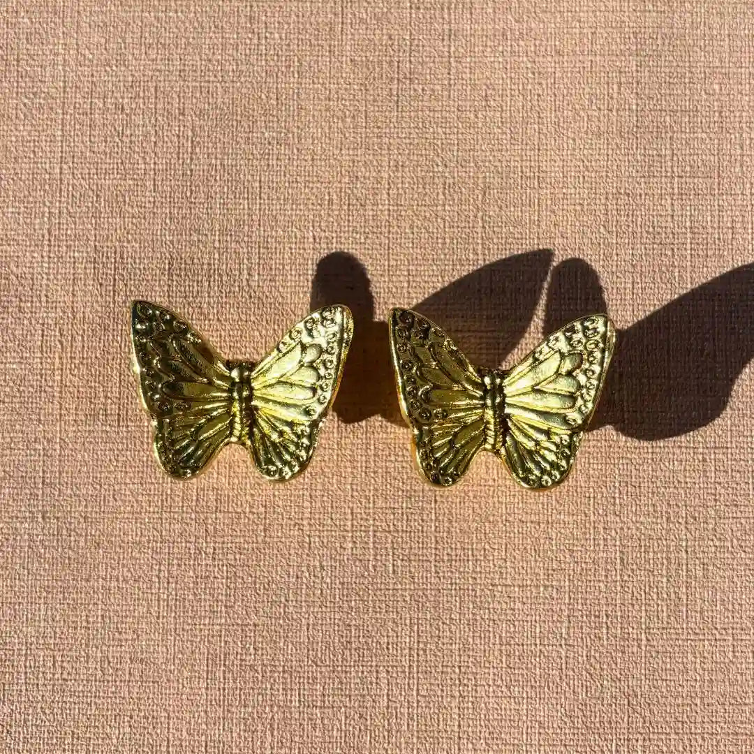 Vlinder deurknop goud